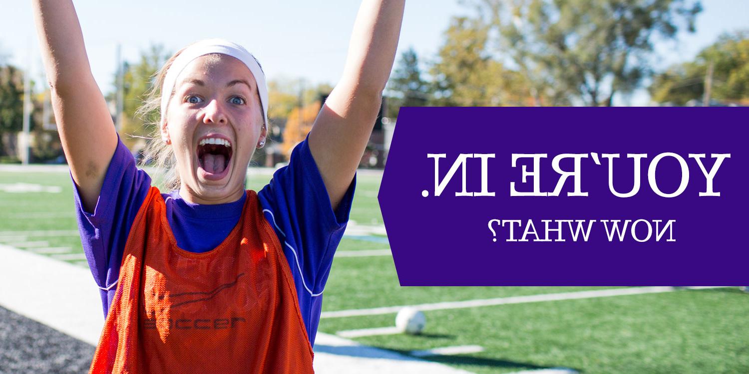 You're in. Now what? Young girl excited with hands raised outside on soccer field.